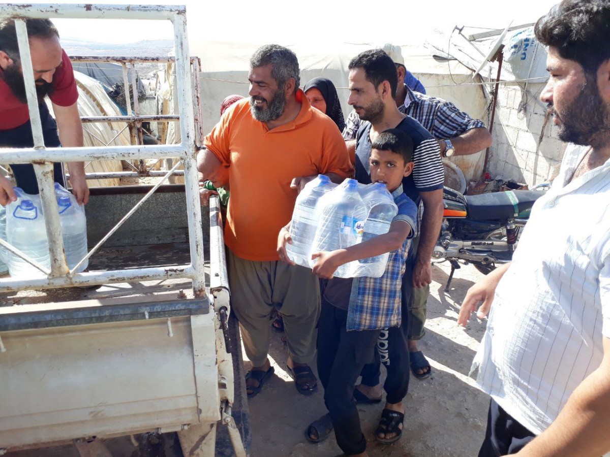 Savaş bölgelerinde su dağıtımı Suriye 33