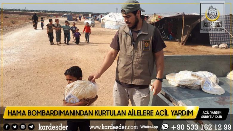 Hama bombardımanından kurtulup Atme kırsalına yerleşen mazlum halka ekmek dağıtımı 14