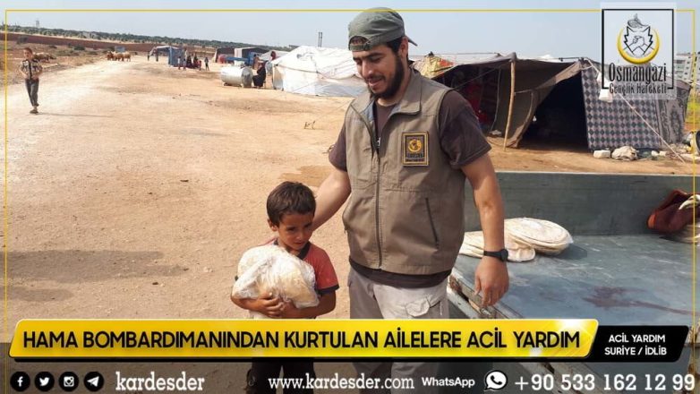 Hama bombardımanından kurtulup Atme kırsalına yerleşen mazlum halka ekmek dağıtımı 31